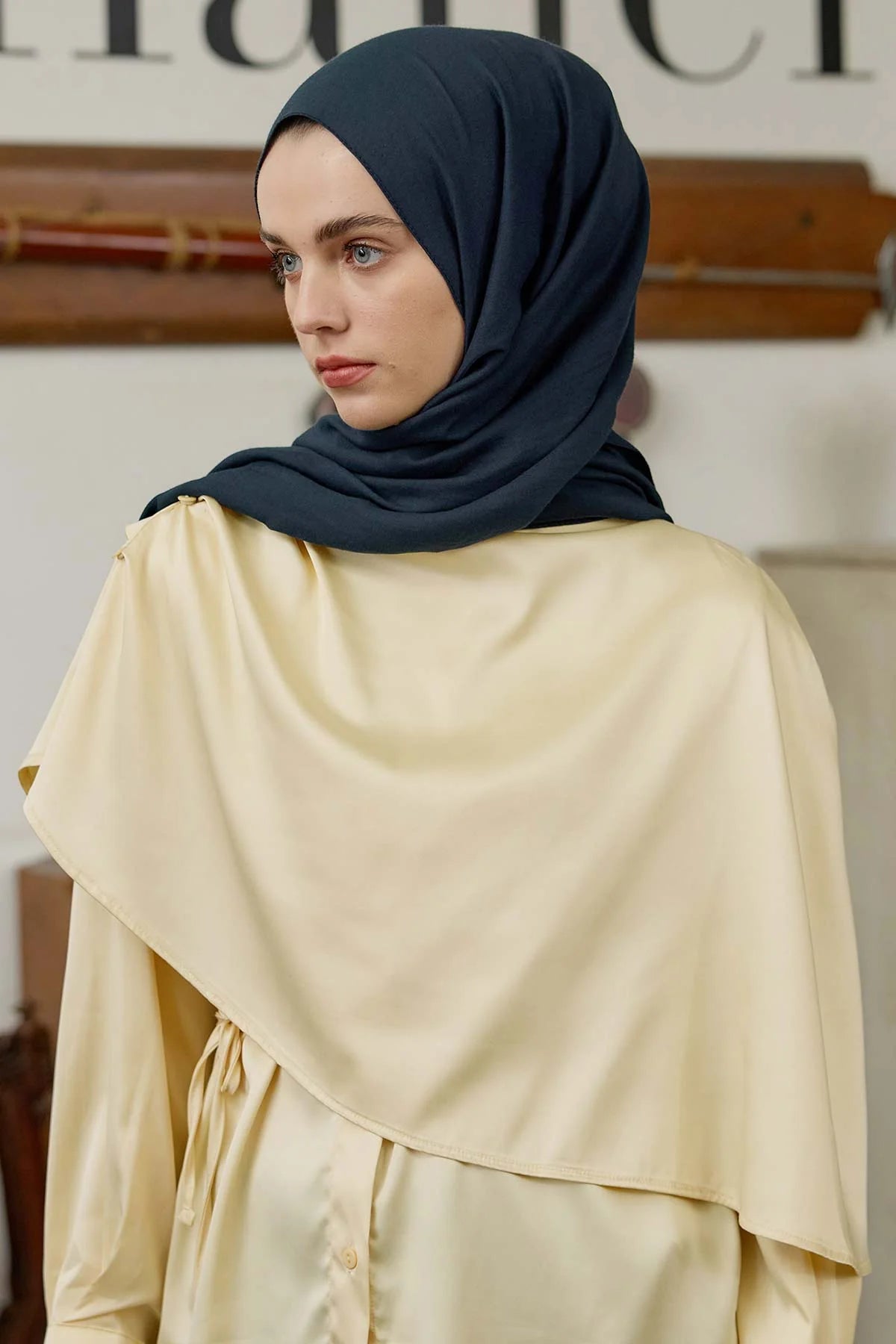Petrol Comfort Cotton Hijab styled with a cream wrap and long skirt, full look