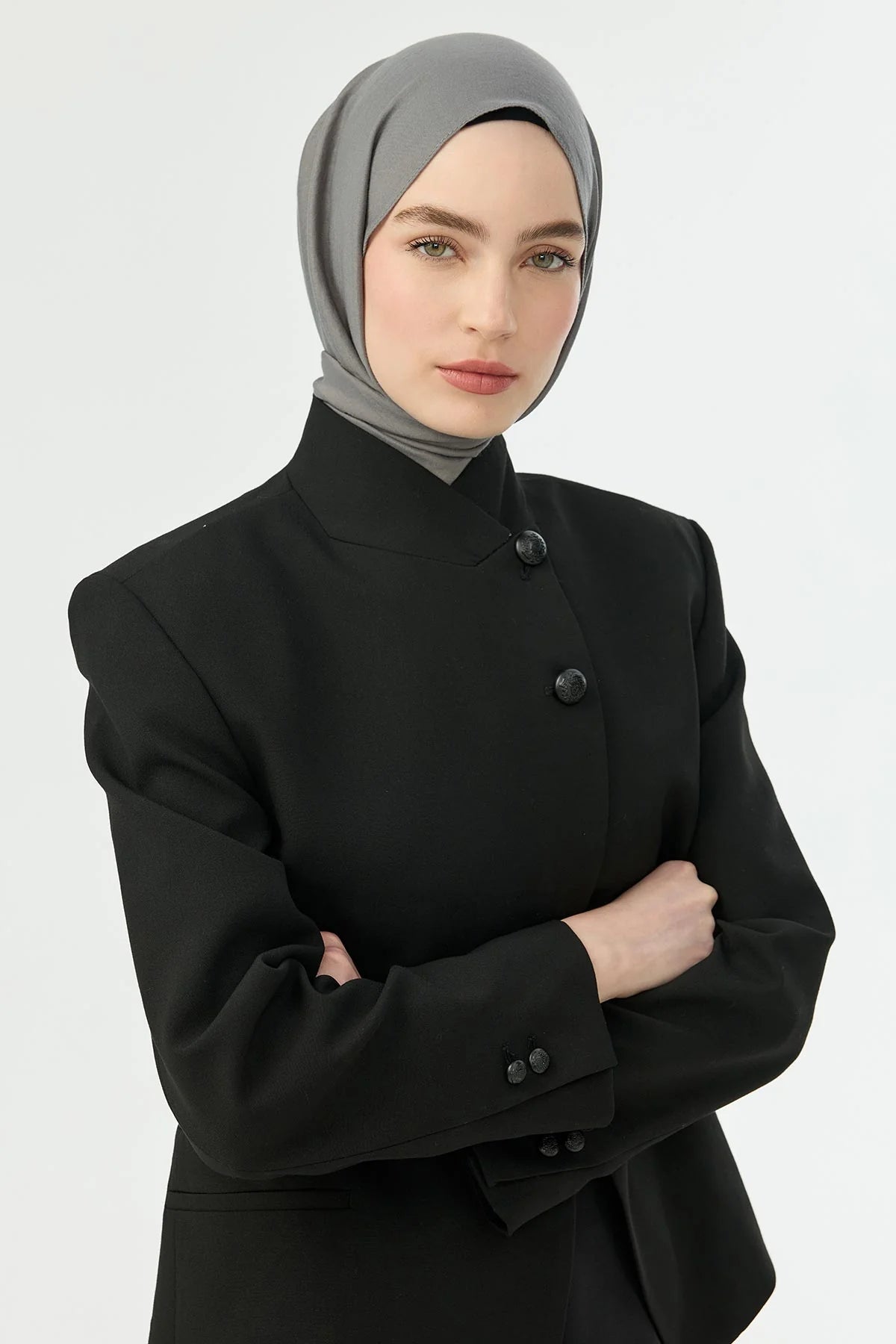 Grey Comfort Cotton Hijab styled with a black structured jacket, front view