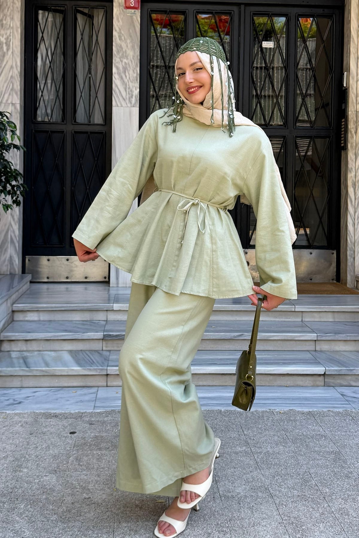 Willow linen set in light green styled with a handbag, side view
