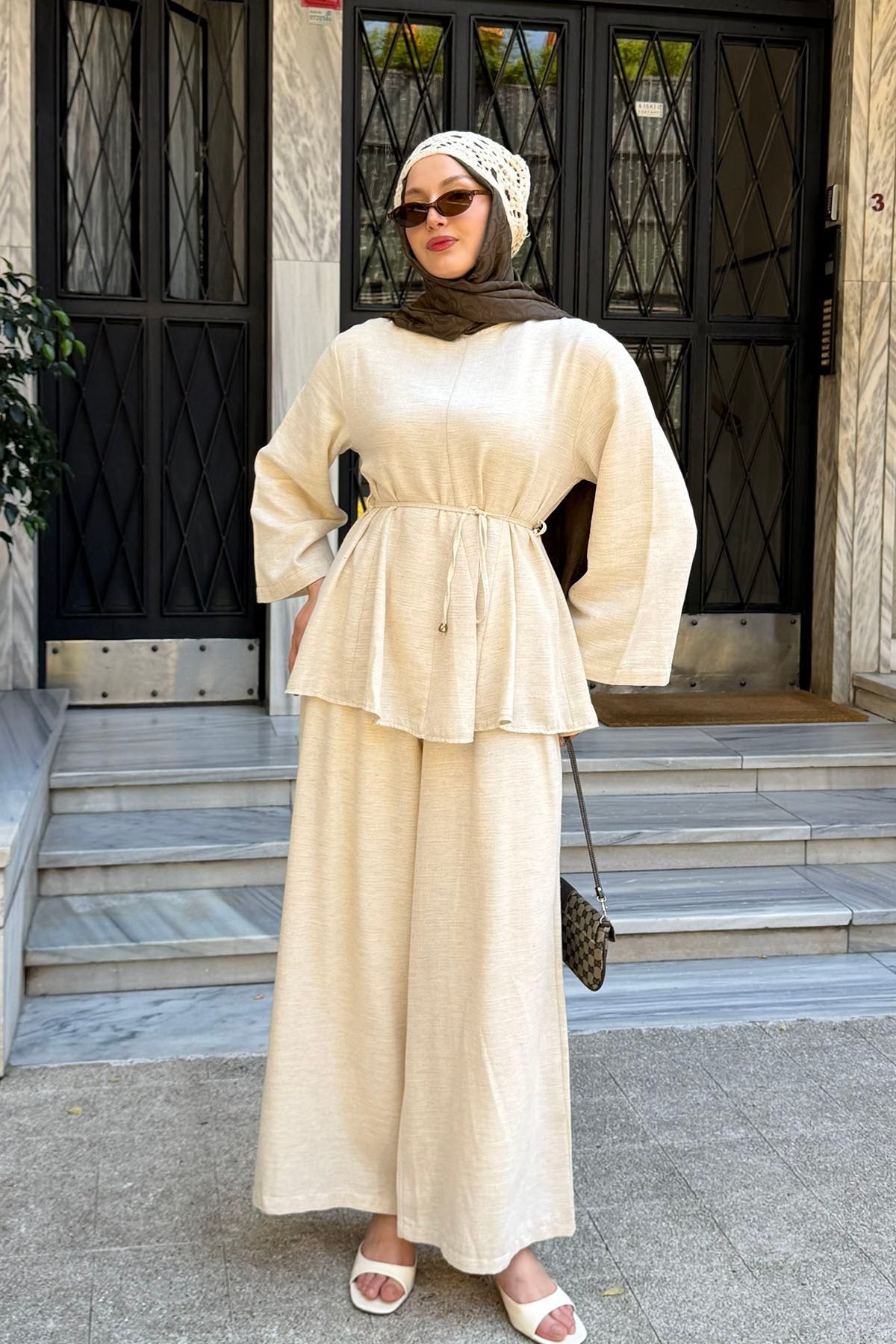 Willow linen set in beige styled with a handbag, side view
