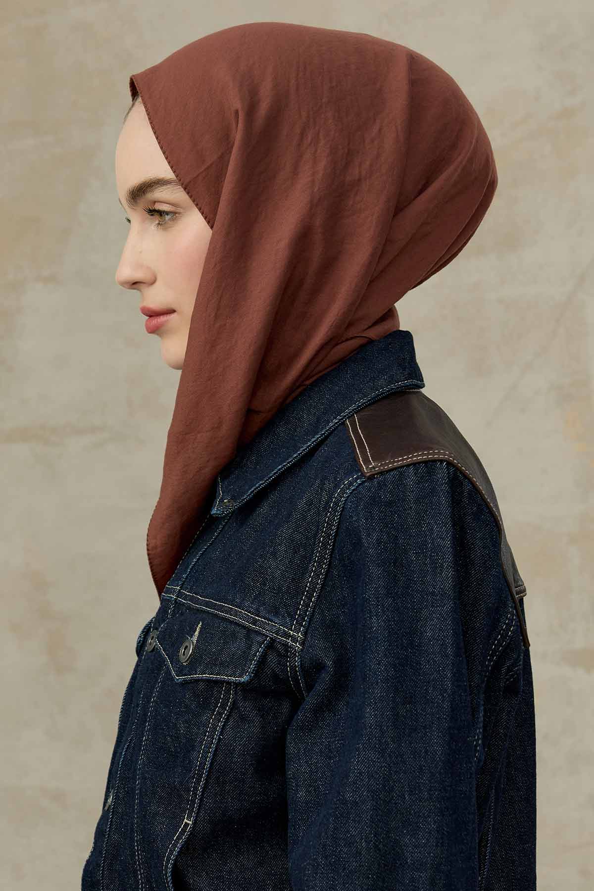 Rust Comfort Cotton Hijab shown in side profile with a denim jacket