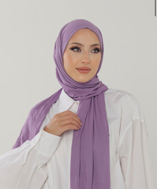 MODESTIQUE Jersey Hijab in Lilac, worn with a white shirt and draped long in front.