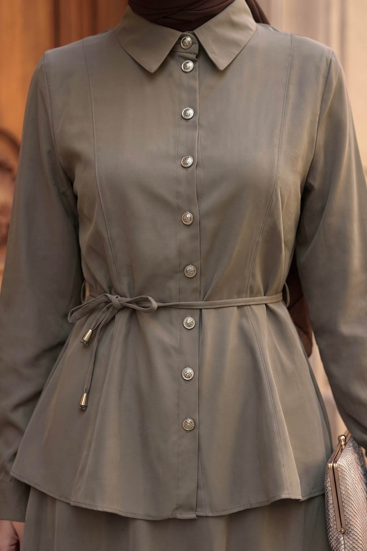 Close-up of the Ayla skirt set in taupe showing the button-front shirt and tie waist