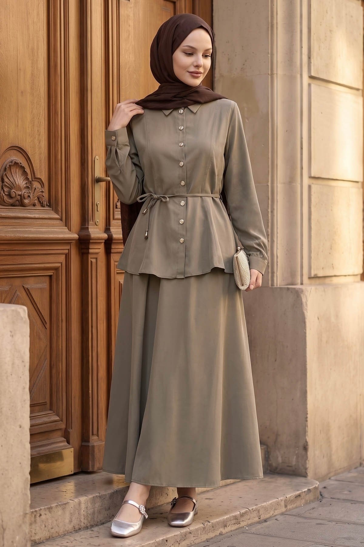 Ayla modest skirt set in taupe styled with a clutch, front view