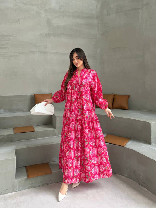 Full-length front view of the MODESTIQUE Peony Bloom Summer Dress in a hot pink floral print, with a white bag.