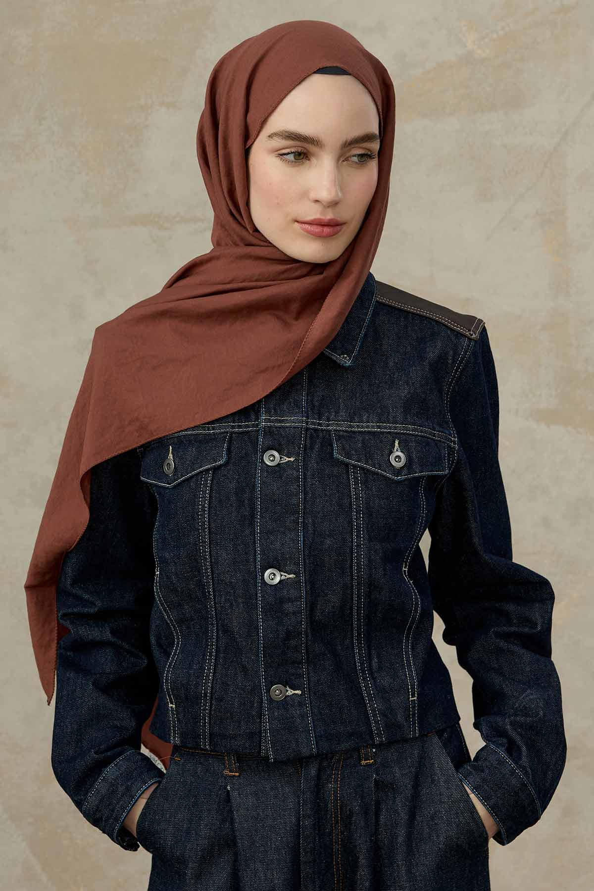 Rust Comfort Cotton Hijab styled with a dark denim jacket, full front look