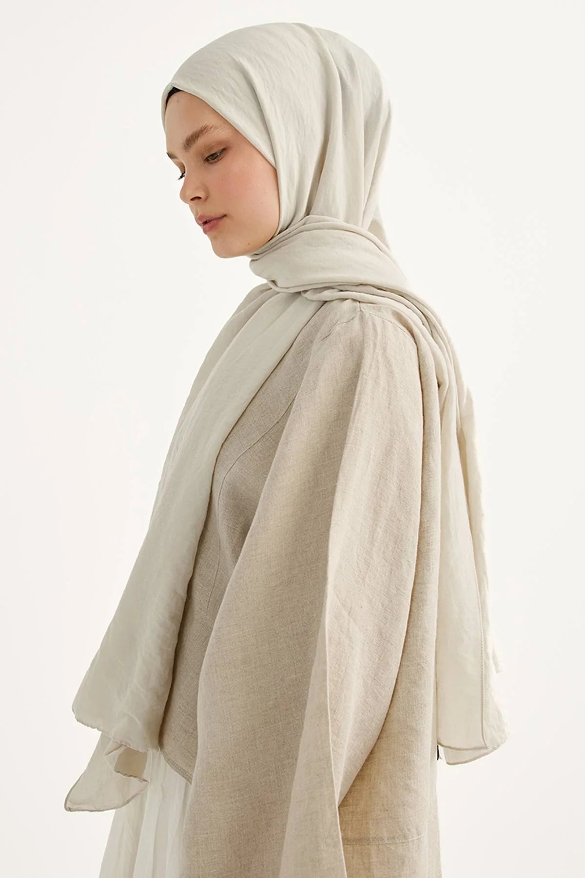 Bone Comfort Cotton Hijab shown from the side, styled with a cream skirt