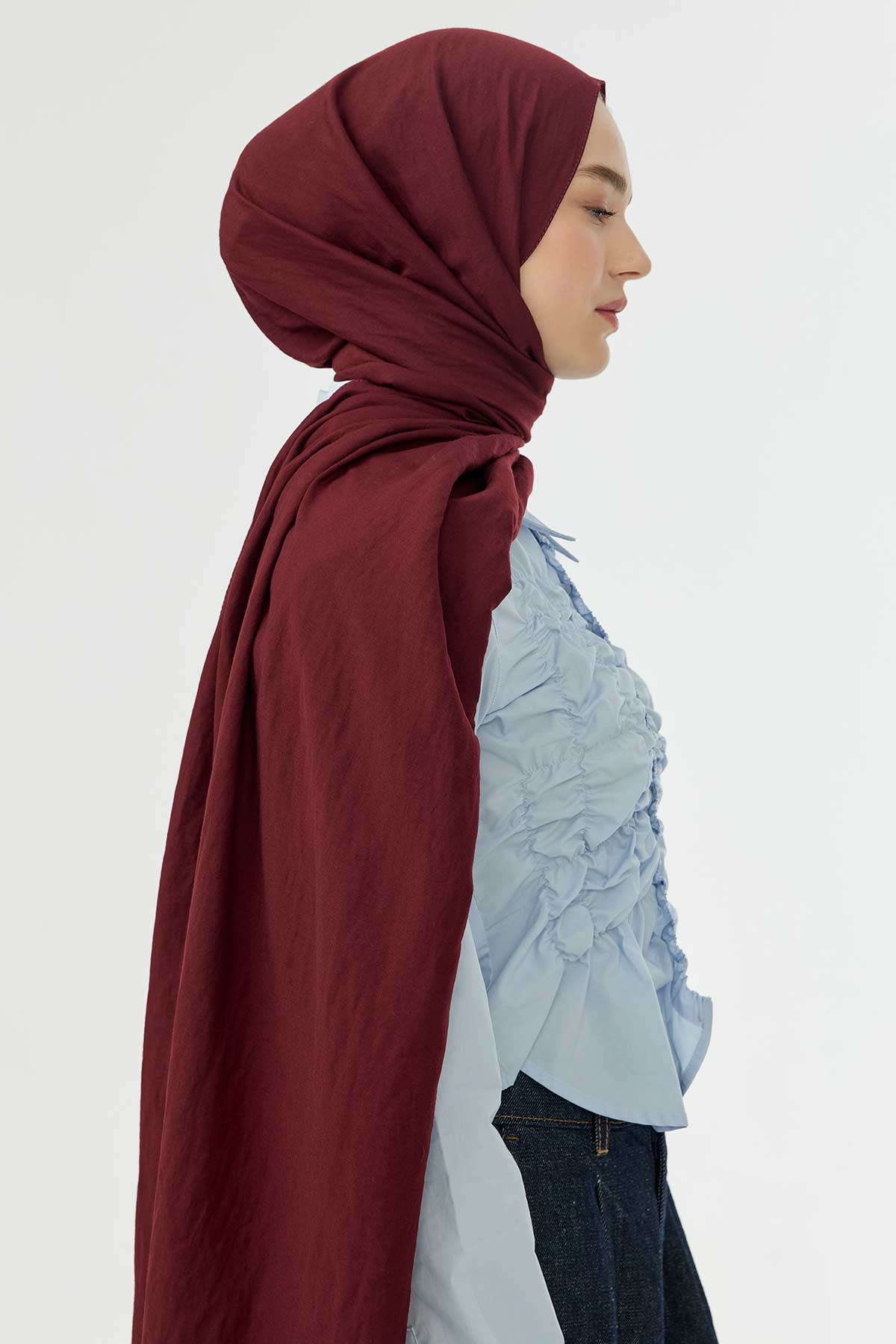 Maroon Comfort Cotton Hijab shown in side profile with a long back drape