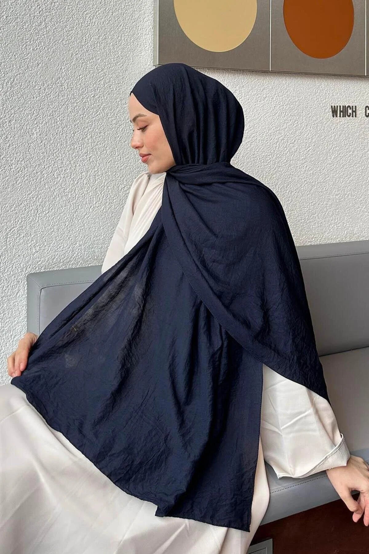 Model wearing the navy Comfort Cotton Hijab with a long, flowing drape