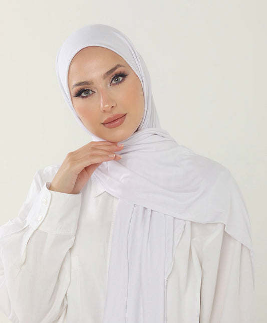 MODESTIQUE Jersey Hijab in White, worn with a white shirt and wrapped softly at the neck.
