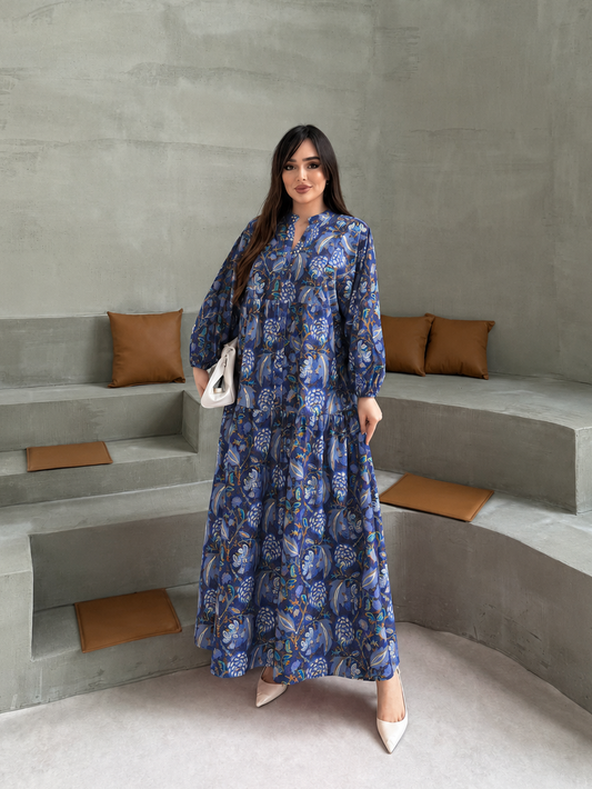 Full-length front view of the MODESTIQUE Blu Bloom Summer Dress, a navy floral maxi with long sleeves.