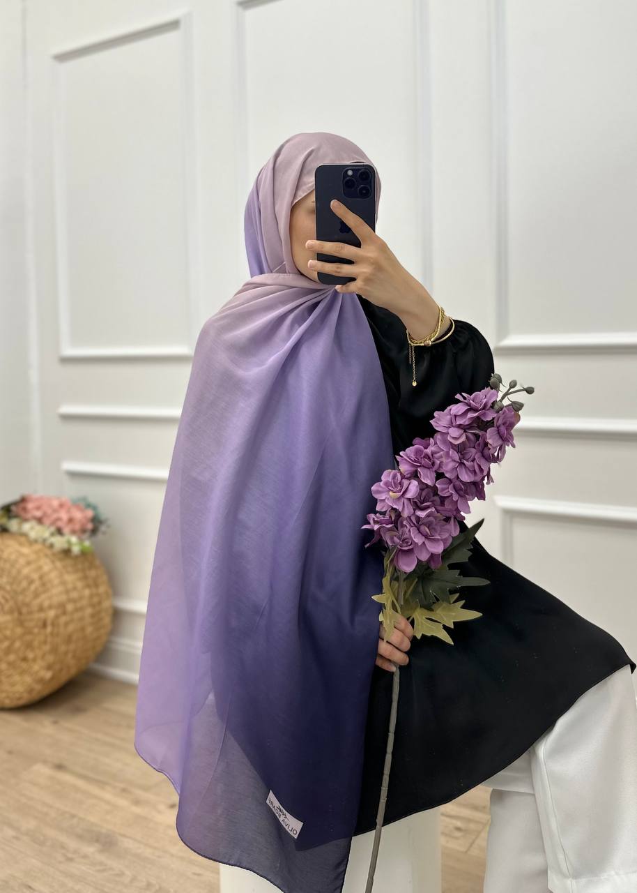 Mirror shot of the MODESTIQUE Ombre Hijab in lavender, showing the full ombre drape with purple flowers.