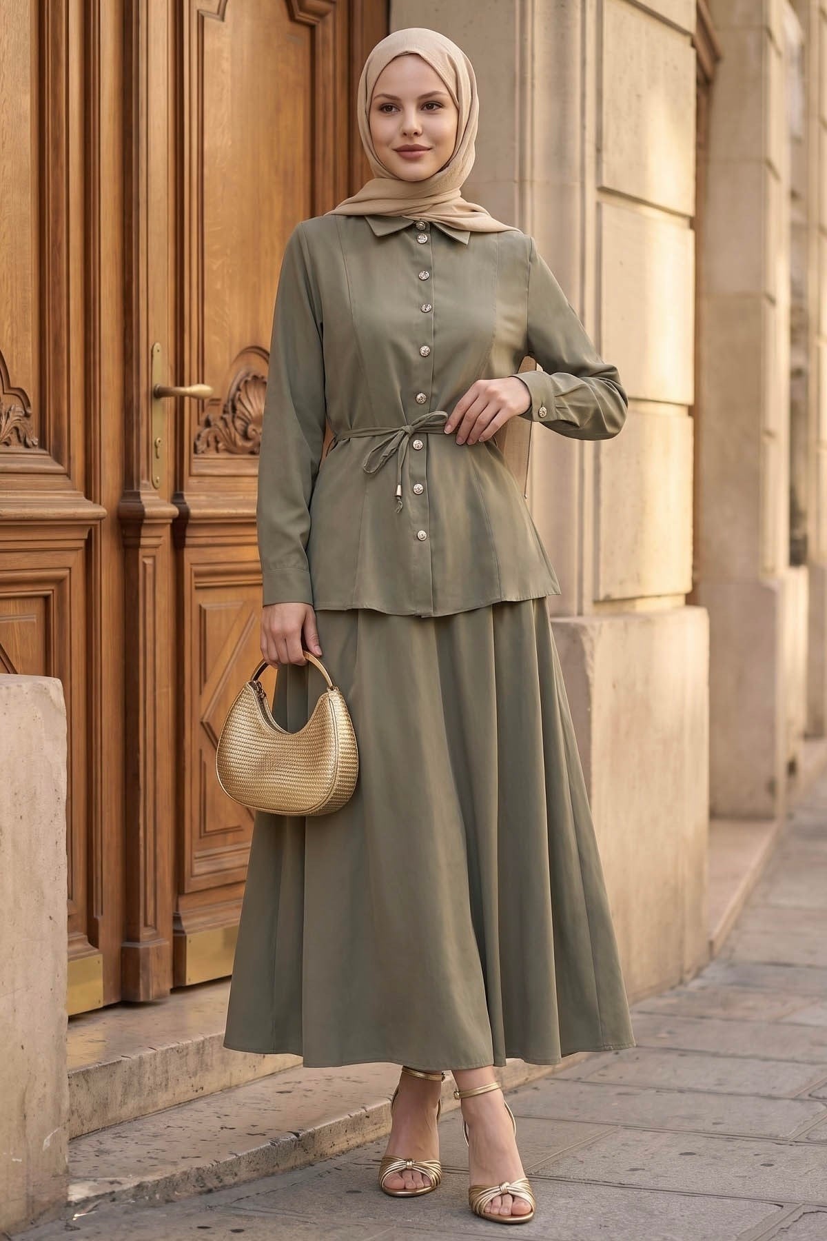 Ayla modest skirt set in sage styled with a woven bag, side view